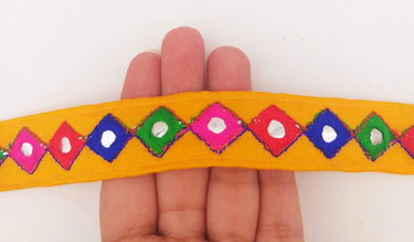Wholesale Yellow Cotton Fabric Mirrored Trim With Embroidery In Fuchsia Pink, Blue, Red & Green Threads